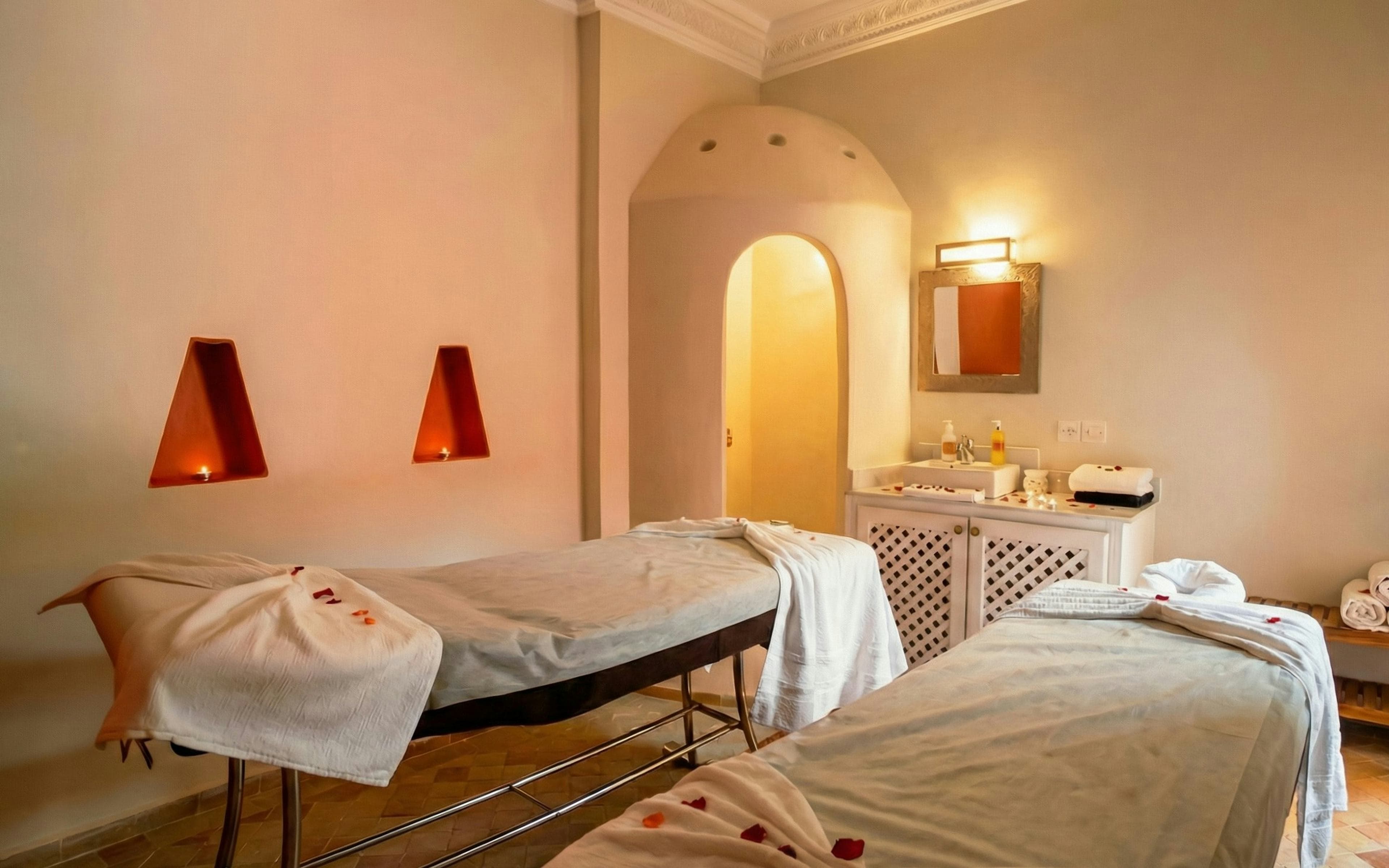 Warm spa treatment room with candle light